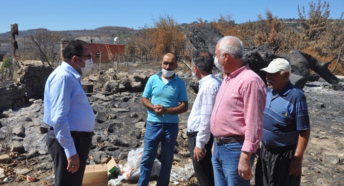 Adana Milletvekili Doğru'dan Kozan'da orman yangınından etkilenen mahalleye ziyaret